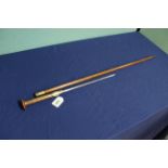 An unusual 'dagger' walking cane with brass furniture and a diamond form blade (11 3/4"),