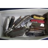 A box of various pocket knives