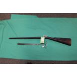 A Victorian air rifle/cane of approx 120 bore with leather covered air reservoir stock,