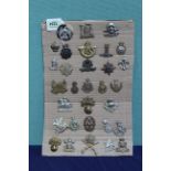 Thirty one British military badges including some fine examples