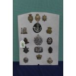 A collection of fifteen British various military badges including five Victorian examples