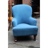 A modern blue fabric armchair