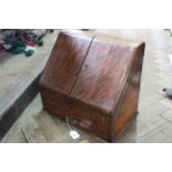 A large late Victorian oak table top stationery cabinet by Waterloo & Sons, London,