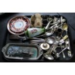 A tray of assorted plated spoons, a napkin ring,