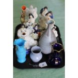 Seven 19th Century Staffordshire figures including a dancing pair, a pocket watch stand and dog,