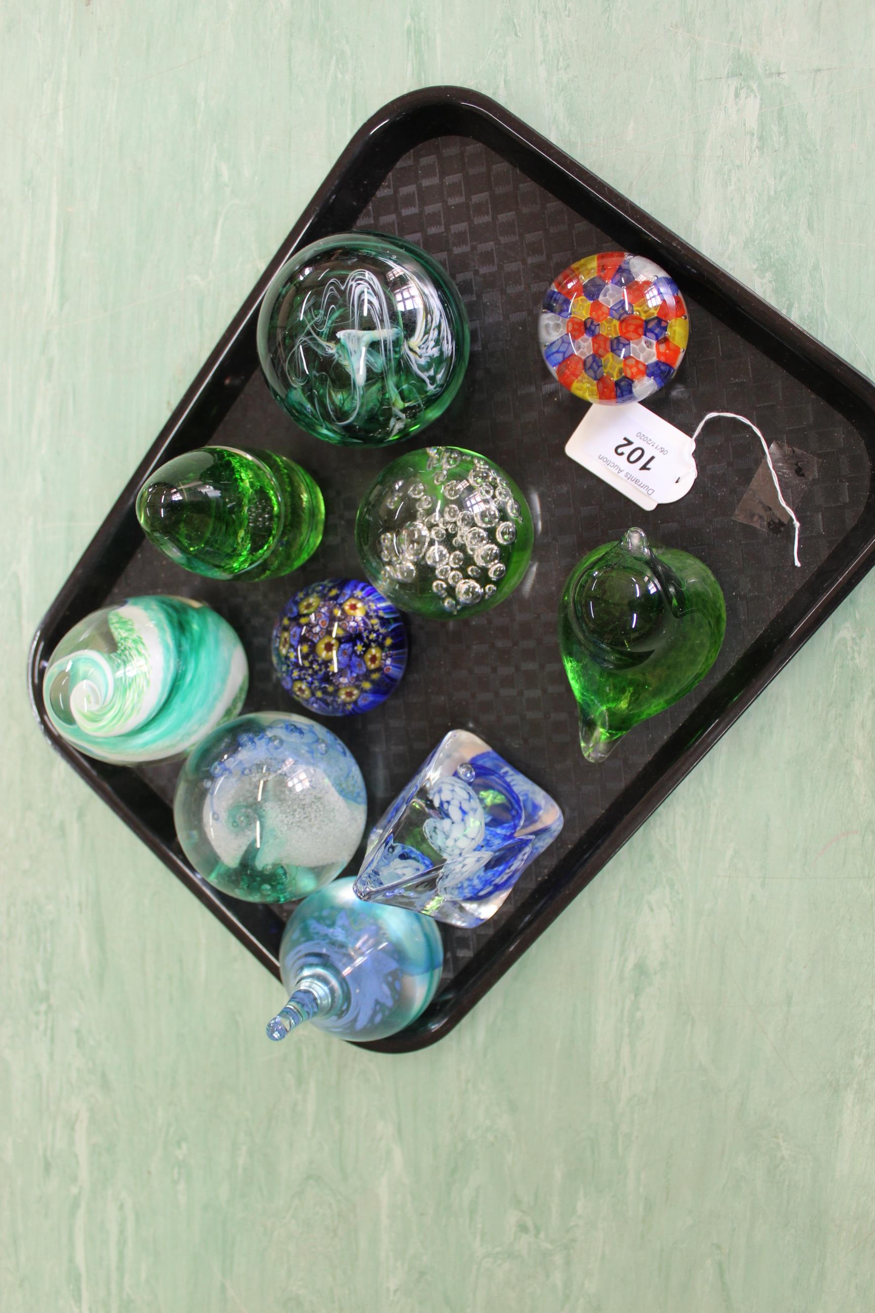 Four Caithness glass paperweights,