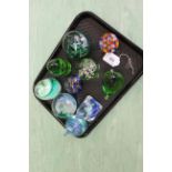Four Caithness glass paperweights,
