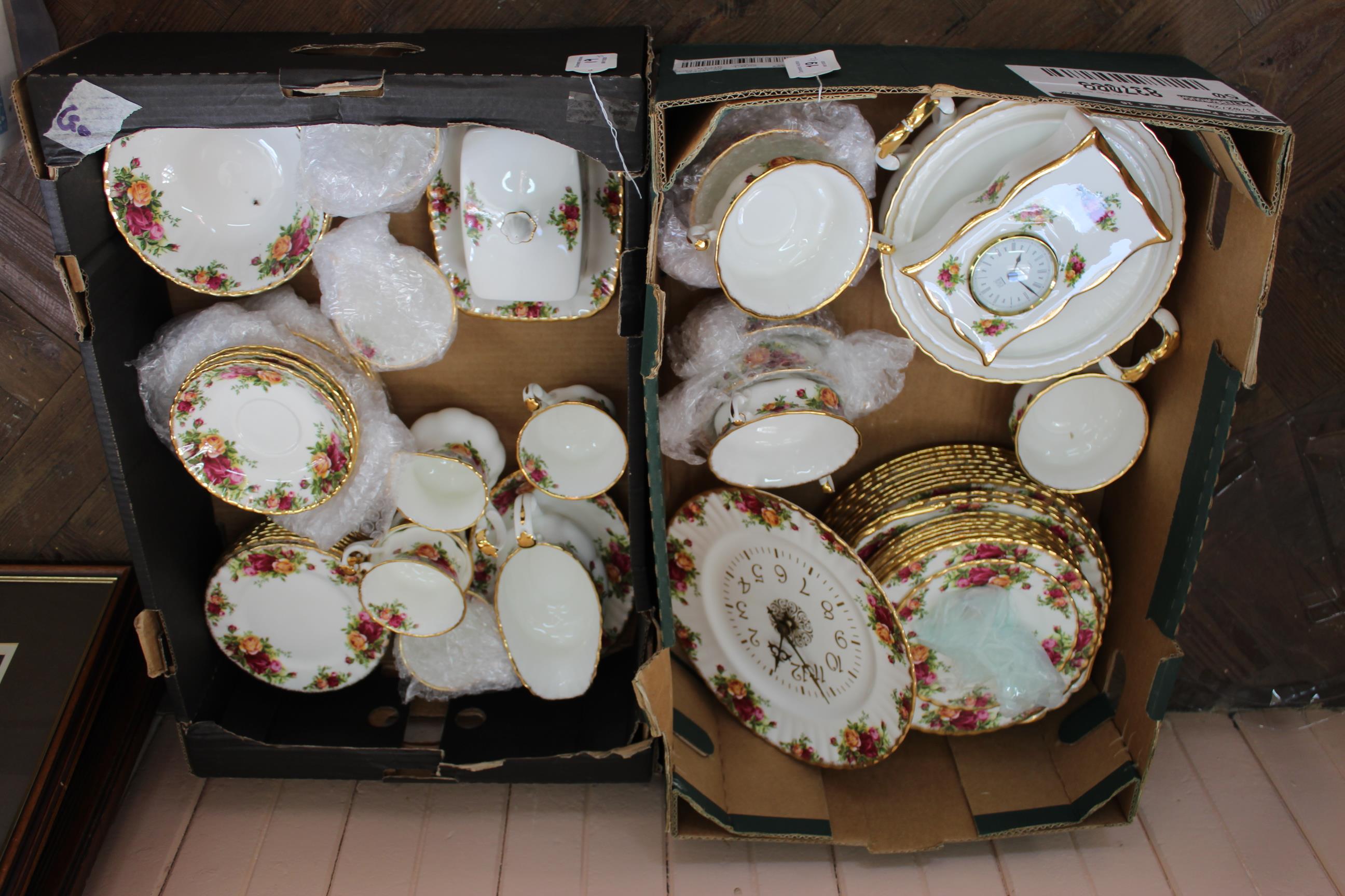 An extensive collection of Royal Albert Country Rose dinner and tea wares (two trays) including a