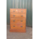 An Edwardian five drawer chest of drawers