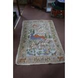 A hand sewn tapestry rug with a scene of a tiger attacking a deer surrounded by other animals,
