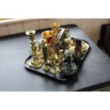 A tray of assorted brass ware including four military figures, two candlesticks,