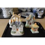 Four 19th Century Staffordshire cottage pastille burners and a pen inkwell example (money box)