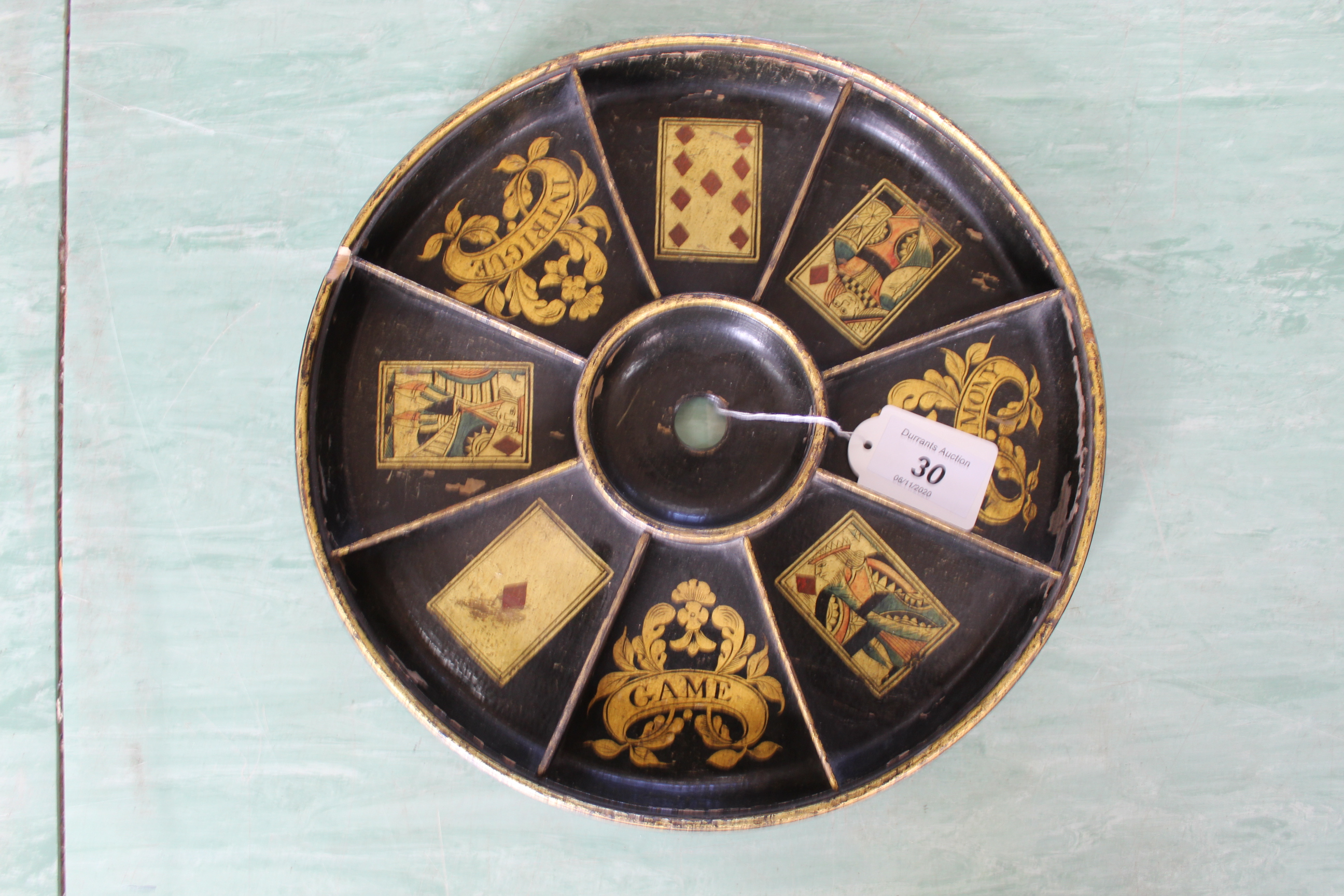 A 19th Century papier mache card tray with gilded card decoration,