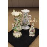 Three early 19th Century flower decorated porcelain vases and ewer