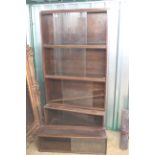 A sectional oak sliding glazed bookcase