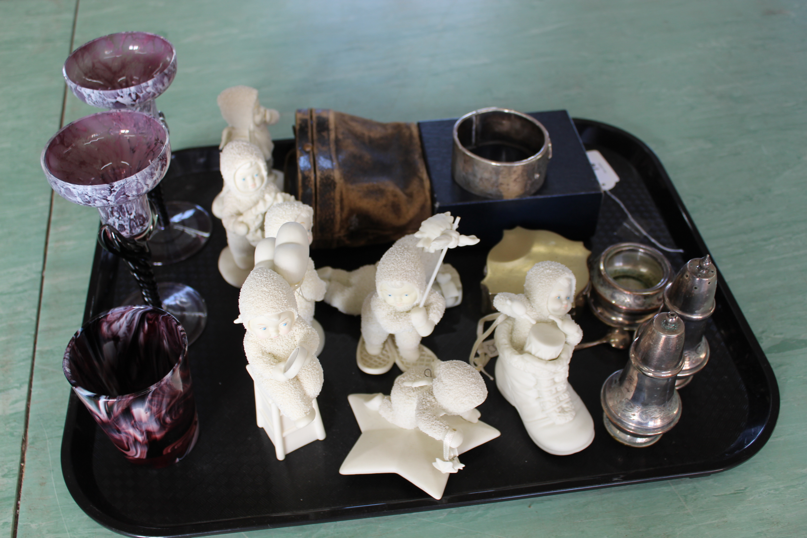 A tray with a selection of 'Department 56' snow babies,