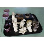 A tray with a selection of 'Department 56' snow babies,
