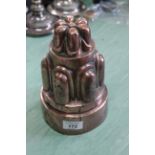 A large Victorian circular copper jelly mould of two tier turret form, stamped '17',