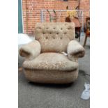 A 1930's upholstered armchair