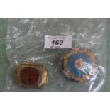 A glass pill box with painted floral decoration,