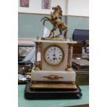 An early 20th Century clock under glass dome, possibly French,