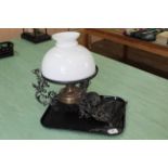 A Victorian cast iron hanging brass oil lamp with shade,