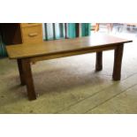 An oak coffee table with chamfered legs