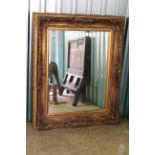 A large modern gilt mirror