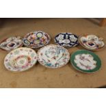 A selection of 18th and early 19th Century hand decorated plates and dishes including Chamberlains,