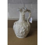 A mid 19th Century Copeland Parian relief moulded ewer decorated with puttis