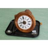 An antique wood cased hanging wall clock with two weights and chains,