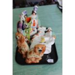 Five 19th Century Staffordshire figures including a pair of orange spaniels,