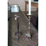 A tall brass Chinese style candle holder,