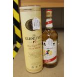 A boxed bottle of Glenlivet twelve year old single malt Scotch whisky and a one litre bottle of