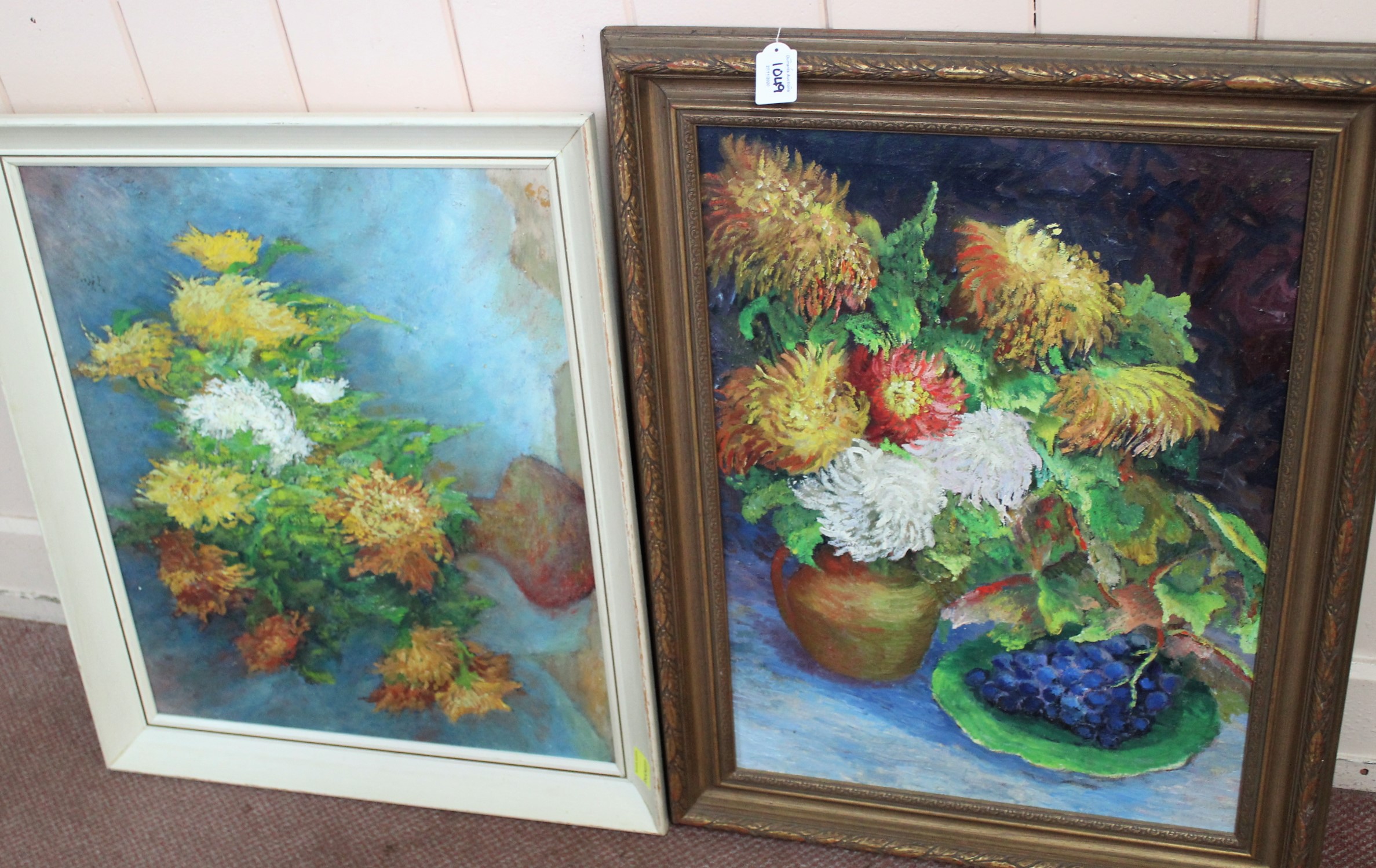 Two framed oil on canvas paintings of flowers