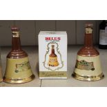 A 375 cl ceramic Bells Scotch whisky together with two 26.