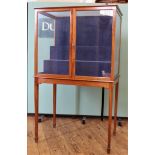 An Edwardian mahogany tiered velvet lined display cabinet, two doors with lock and key,