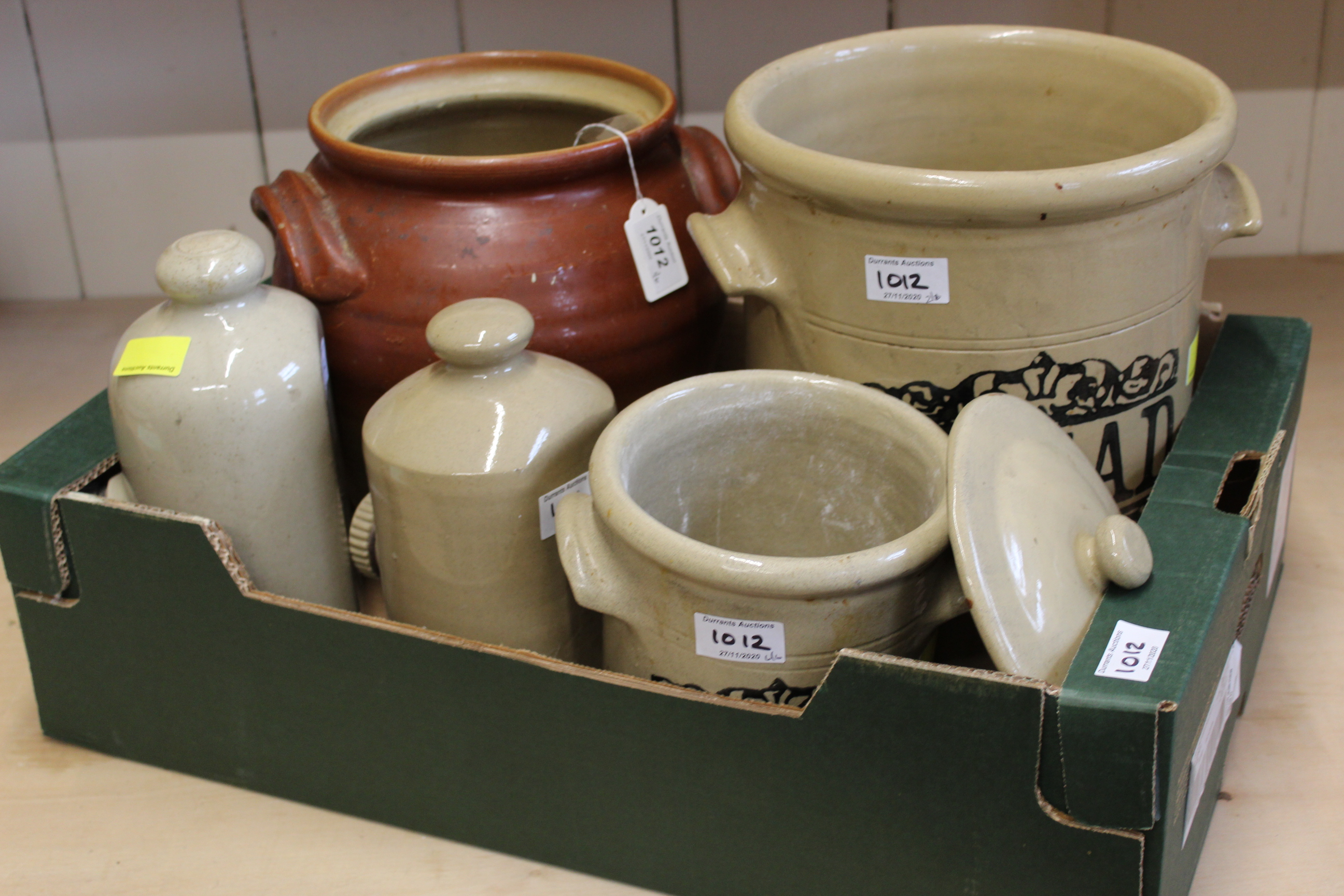 A large stoneware jar together with a bread jar,