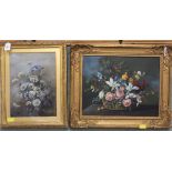 A framed oil on canvas still life of flowers, signed E.J.