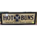 A framed advertising poster with slogan "Hot Buns Made With Skylark Yeast"