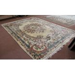 A large Chinese cream ground and floral rug wool carpet 150" x 112"
