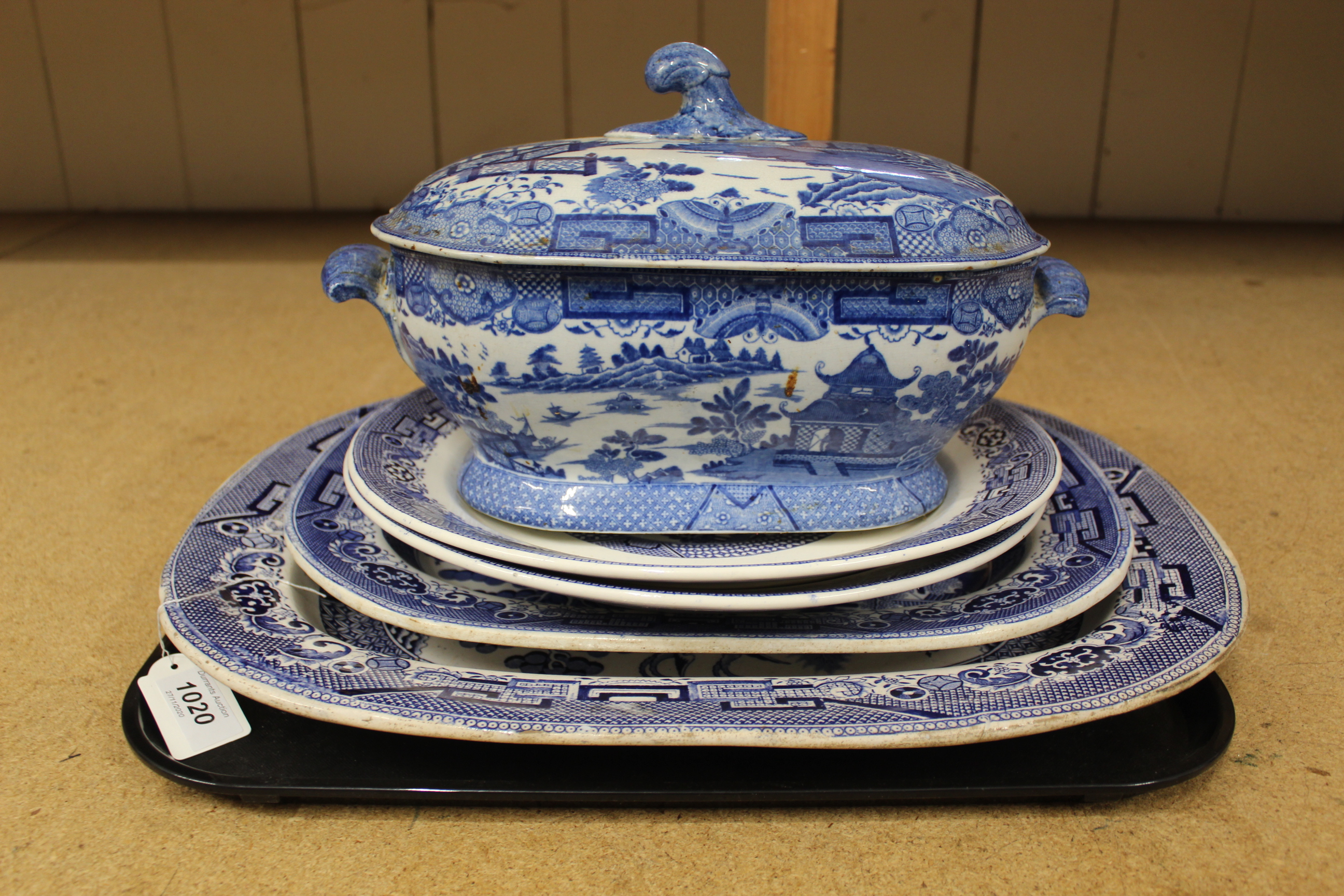 Two large willow pattern meat plates, largest with chip,