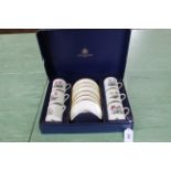 A Royal Worcester boxed set of six coffee cups and saucers decorated with different plants