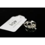 A 9ct gold white gold illusion set diamond ring, size N,