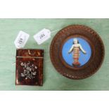 A hand painted on pottery plaque miniature of Christ child,