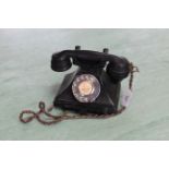 A vintage black Bakelite GPO telephone marked FWR 59/2 to base