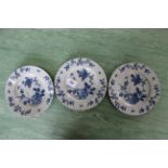 Three 18th Century Delft plates hand painted with rock and flowers with insects between,