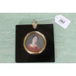 A late 18th/early 19th Century portrait miniature on ivory of a lady in ebony frame,