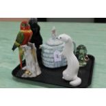 A tray of mixed items including a moulded glass paperweight of a dog,
