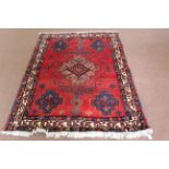 A Persian Kashan rug,